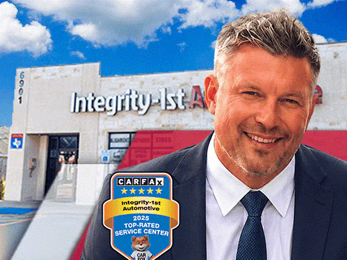 The manager of the North Plano Integrity 1st Car Pros shop, outside the building