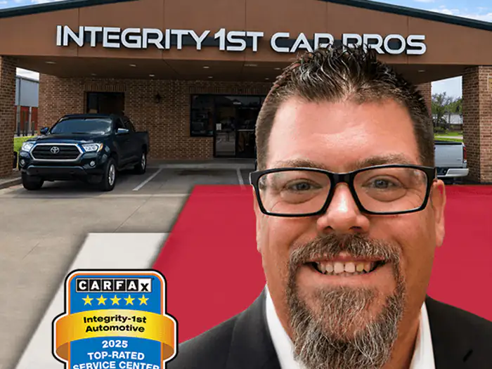 The manager of the Katy Integrity 1st Car Pros shop, outside the building