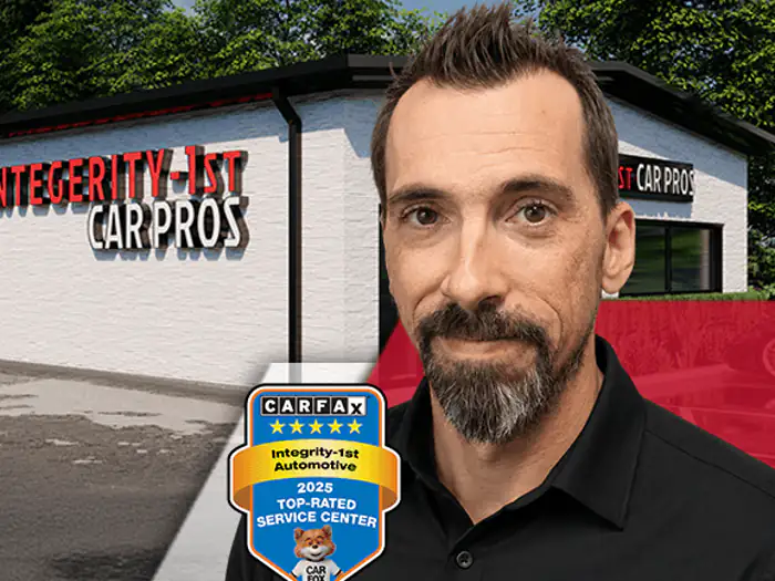 The manager of the Sachse Integrity 1st Car Pros shop, outside the building
